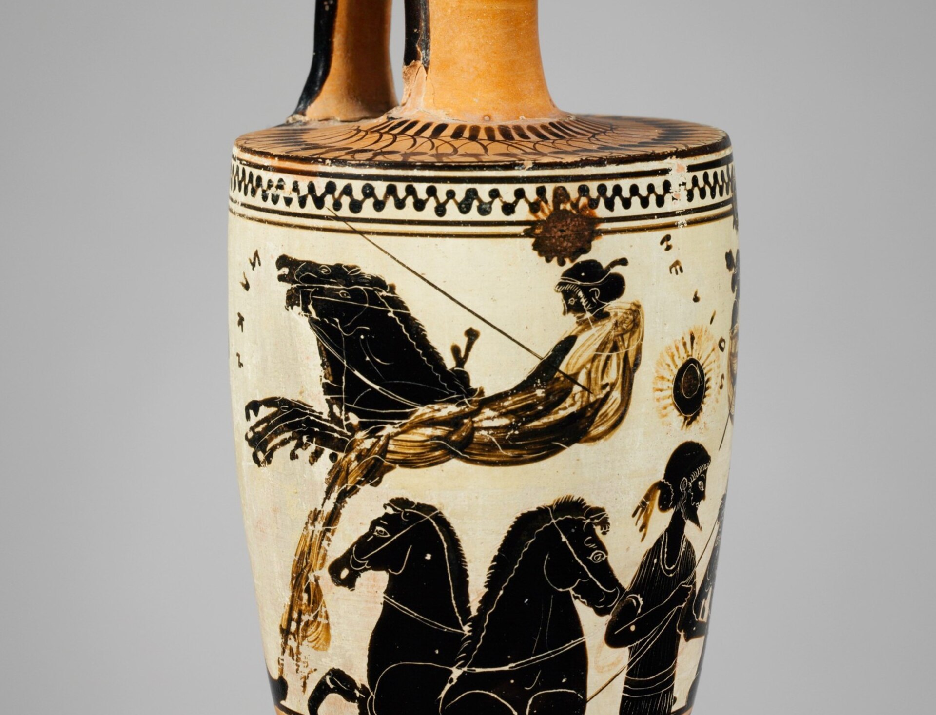 Nyx driving her chariot left above Helios, detail of an ancient Greek oil flask